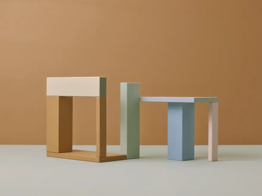 An abstract image with earthy orange, green, and blue blocks stacked on top of each other.